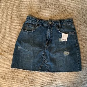 Denim skirt. Brand new. Size M. Original price $60